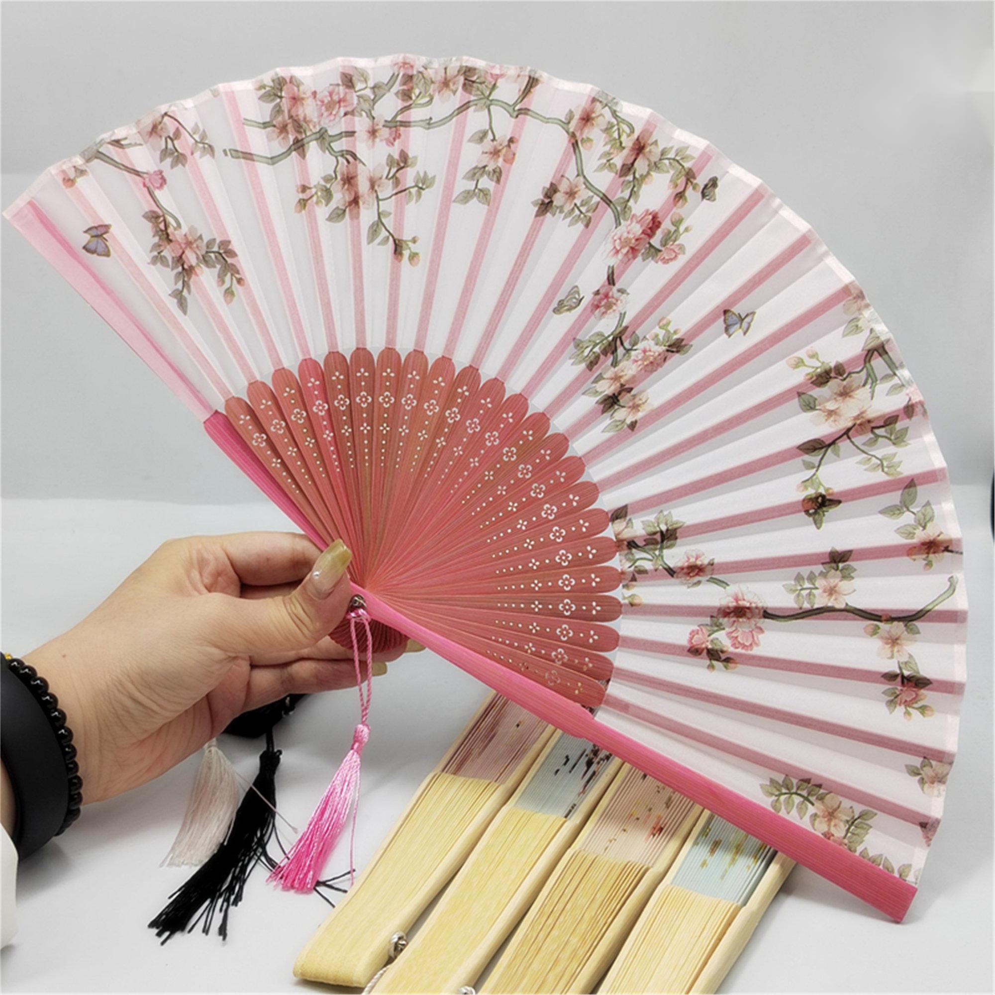 Floral patterns and perforated bamboo folding fans