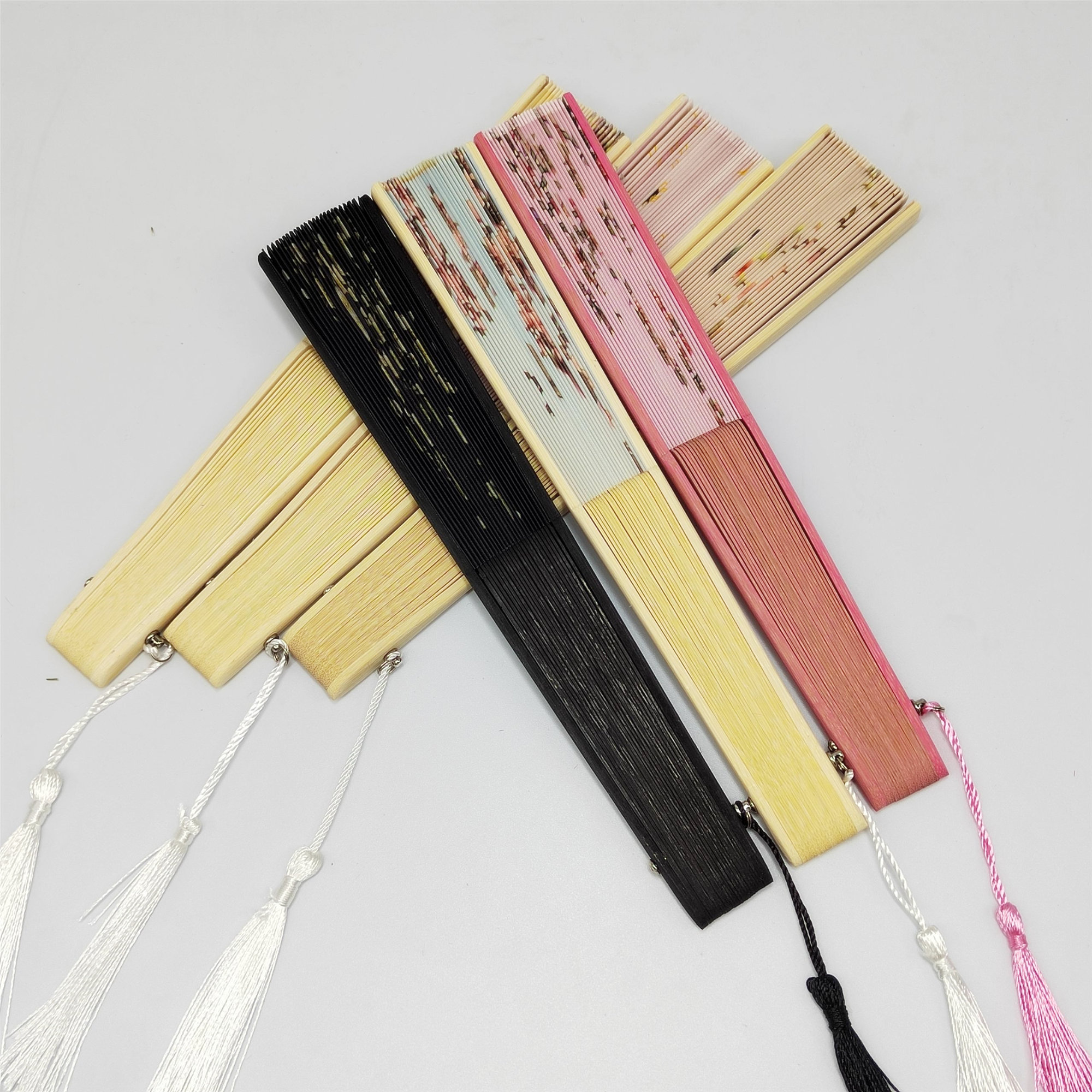 Floral patterns and perforated bamboo folding fans - Image 5