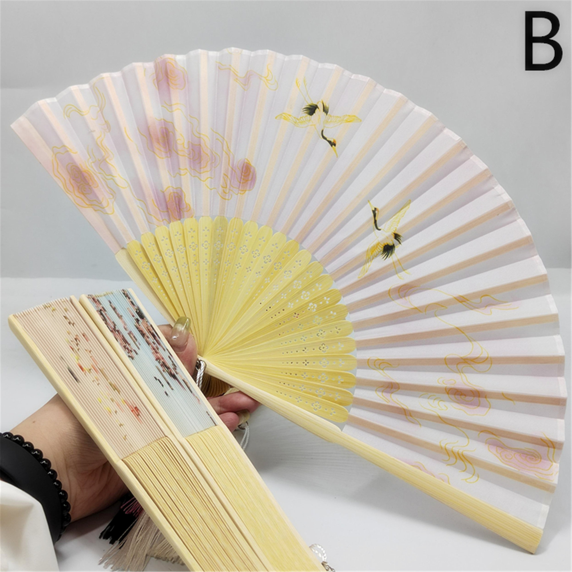Floral patterns and perforated bamboo folding fans - Image 2