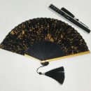 Black folding fan with gold ink splash pattern