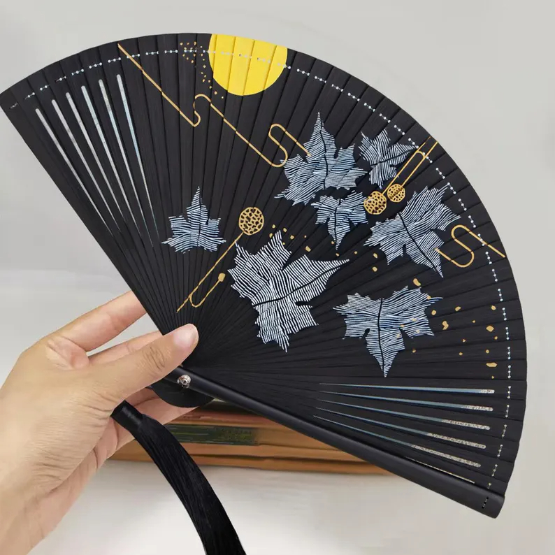 Folding fan with silver maple leaf and gold moon pattern - Image 2