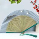 Golden mountain outline tassel folding fan