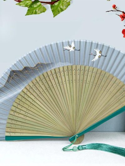 Golden mountain outline tassel folding fan